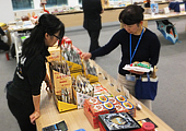 A Photo of people buying products at the sales campaign at head office