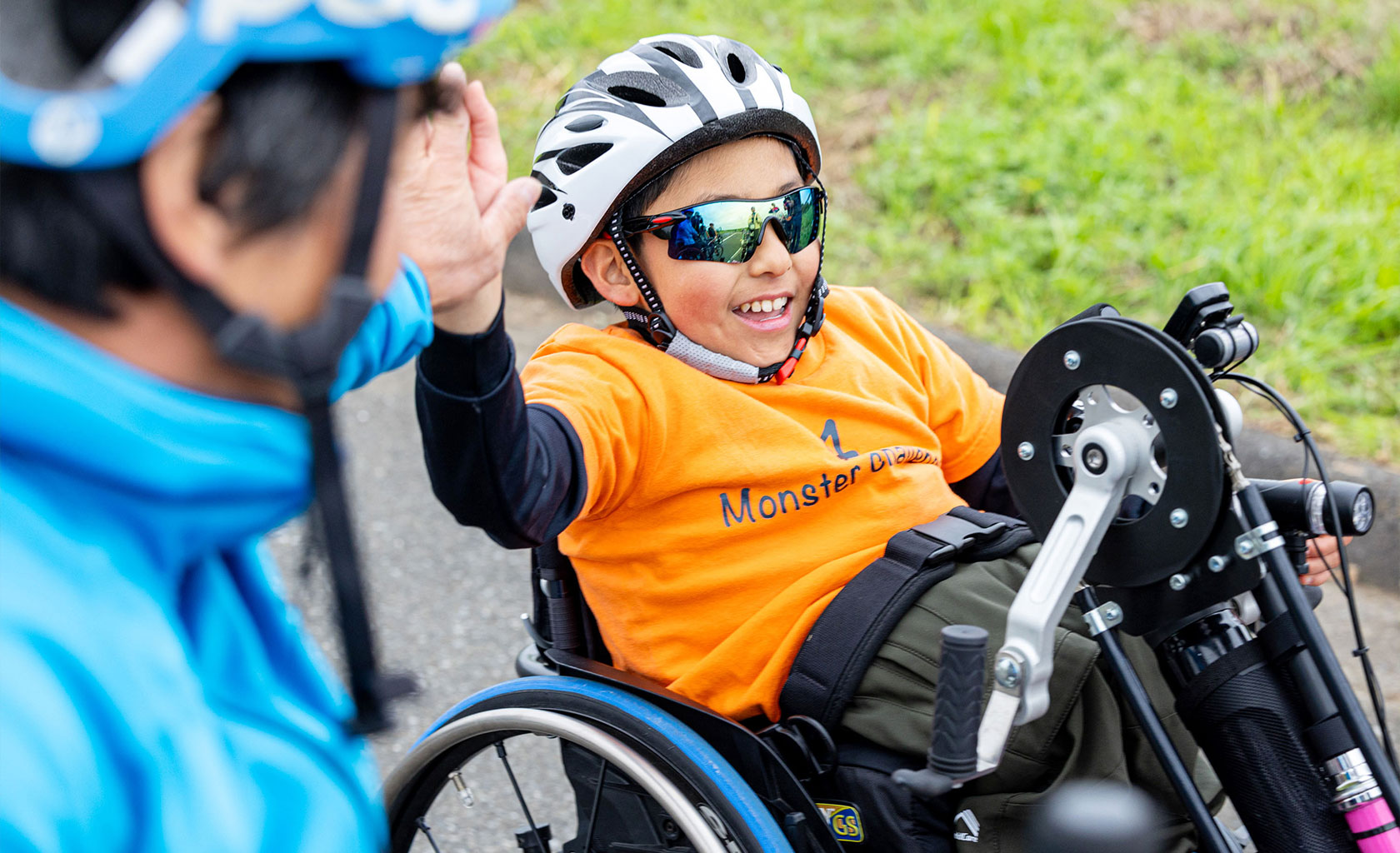 children enjoying a hand cycle